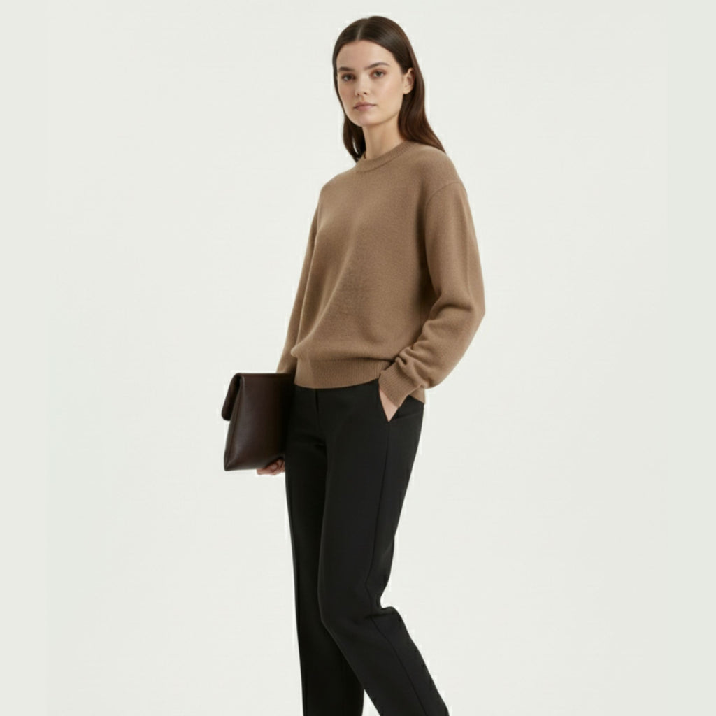 Female model wearing a Beige, regular-fit relaxed-arm sweater made of 100% cashmere pashmina, paired with black trousers.