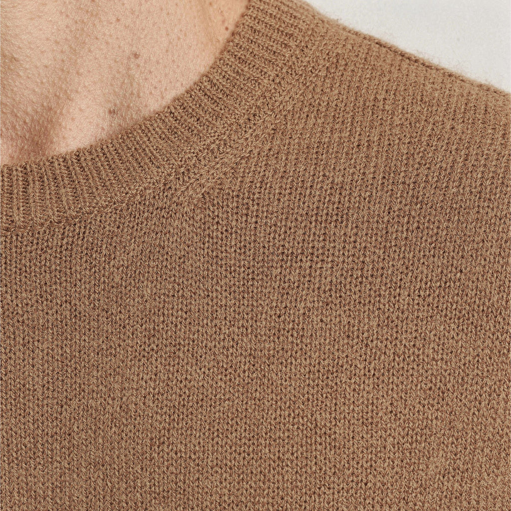 Close-up of a brown knitted 100% Cashmere texture. 