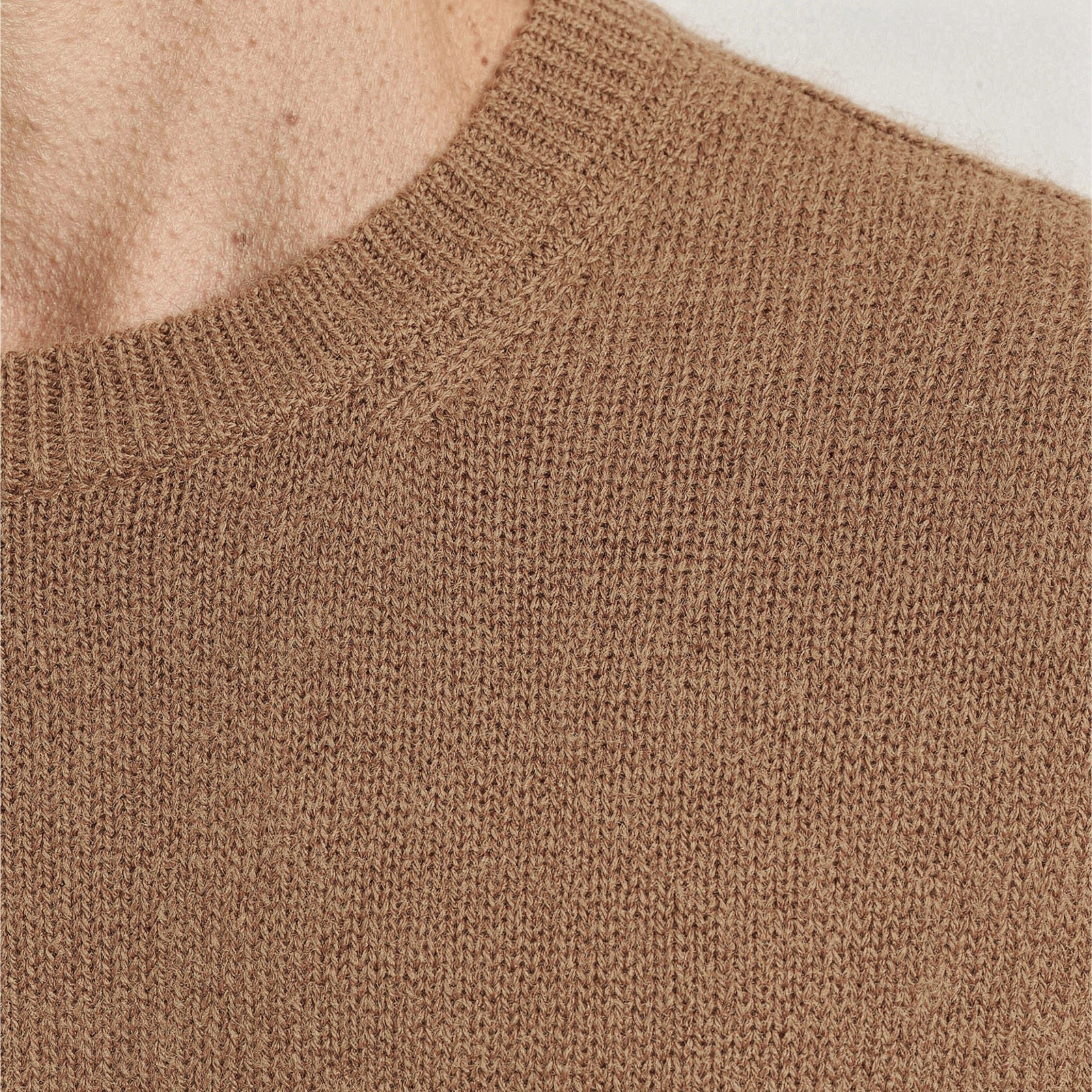 Close-up of a brown knitted 100% Cashmere texture. 