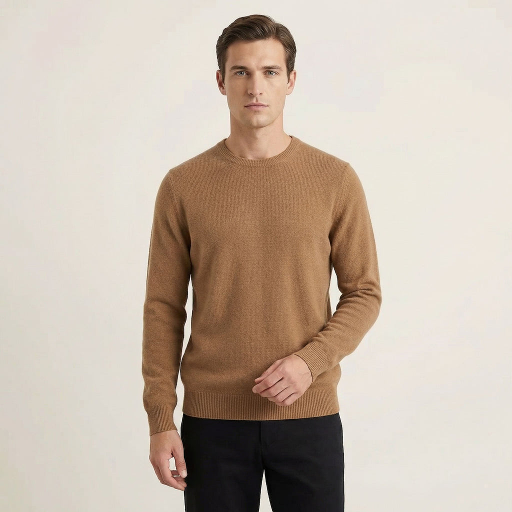 Man wearing a brown 100% Cashmere sweater on a plain background.