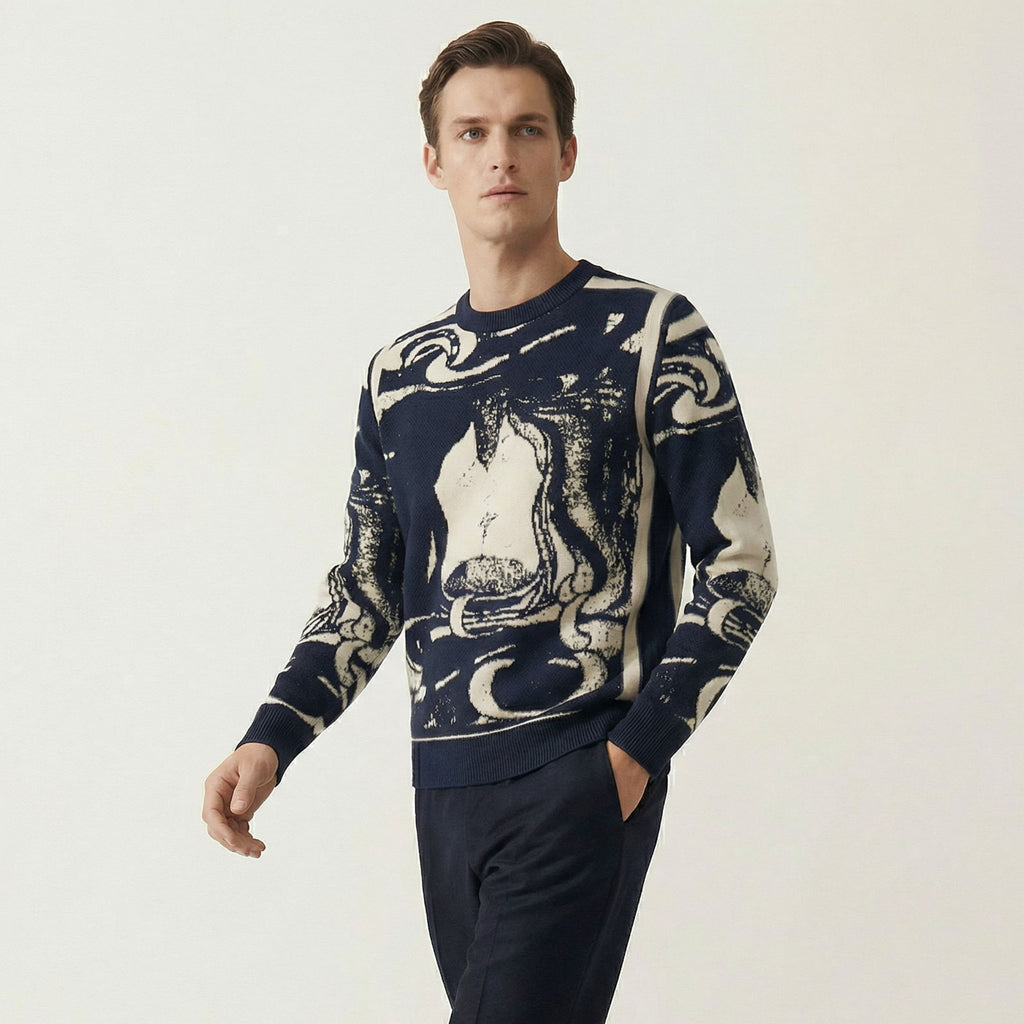 Man wearing a 100% cashmere navy sweater with abstract white design on a light gray background