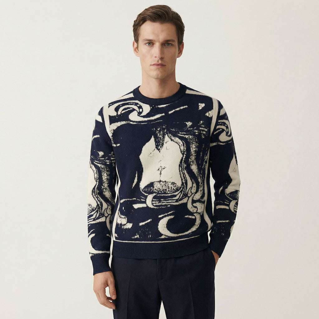 Man wearing a 100% cashmere navy sweater with abstract white design on a light gray background